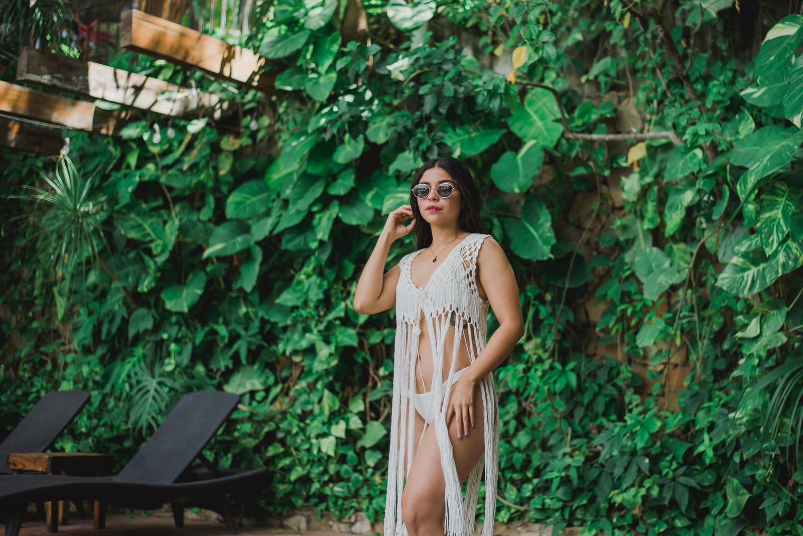 Woman in a light summer outfit at a tropical resort