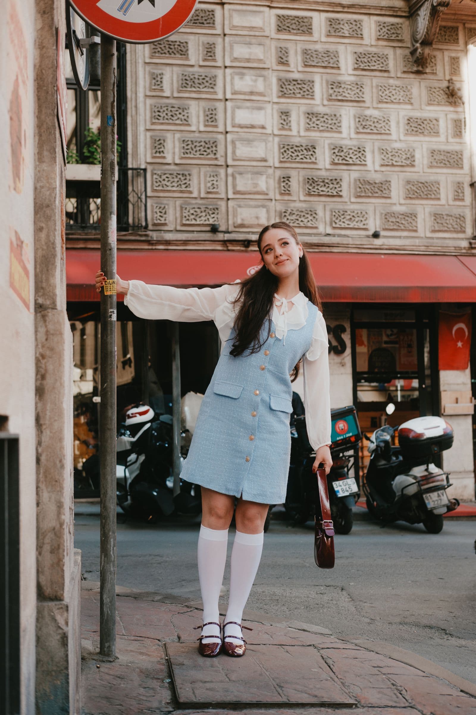 Woman in a polished spring outfit on an urban street